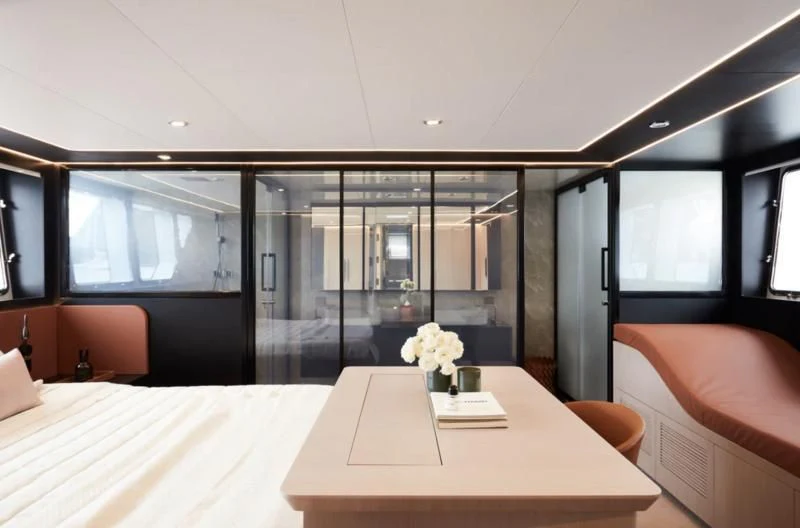a room with a table and chairs aboard LONGREEF 90/01 SX Yacht for Sale