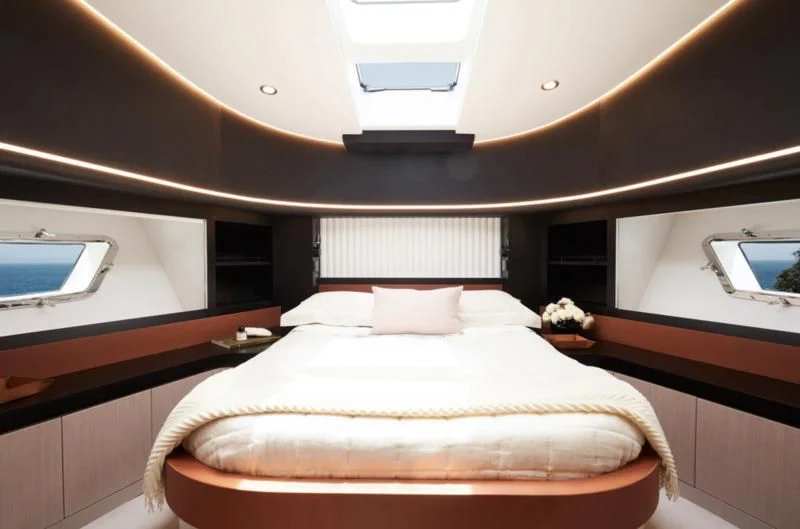 a bed with a white cover aboard LONGREEF 90/01 SX Yacht for Sale