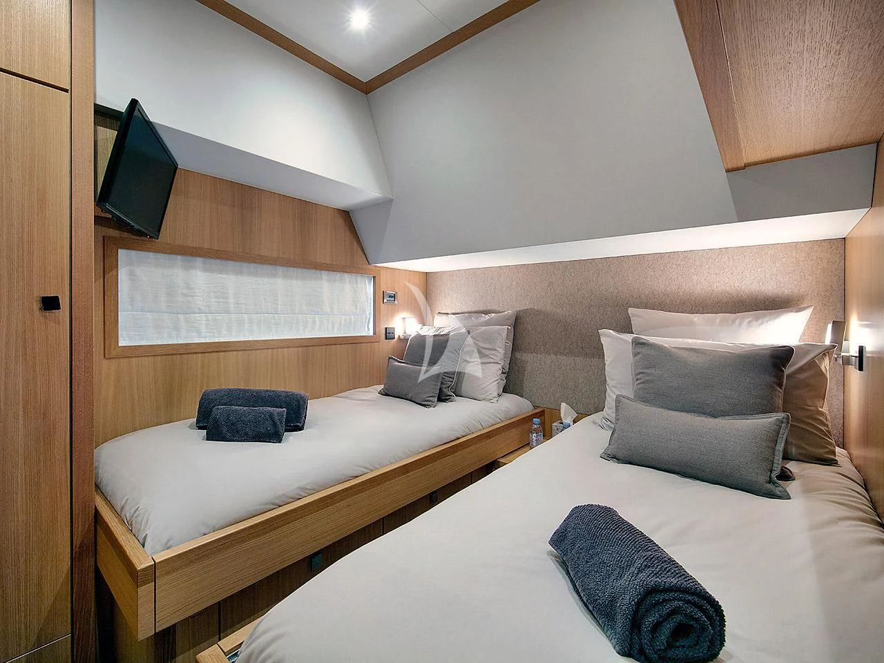 a room with two beds aboard ARMONEE Yacht for Sale