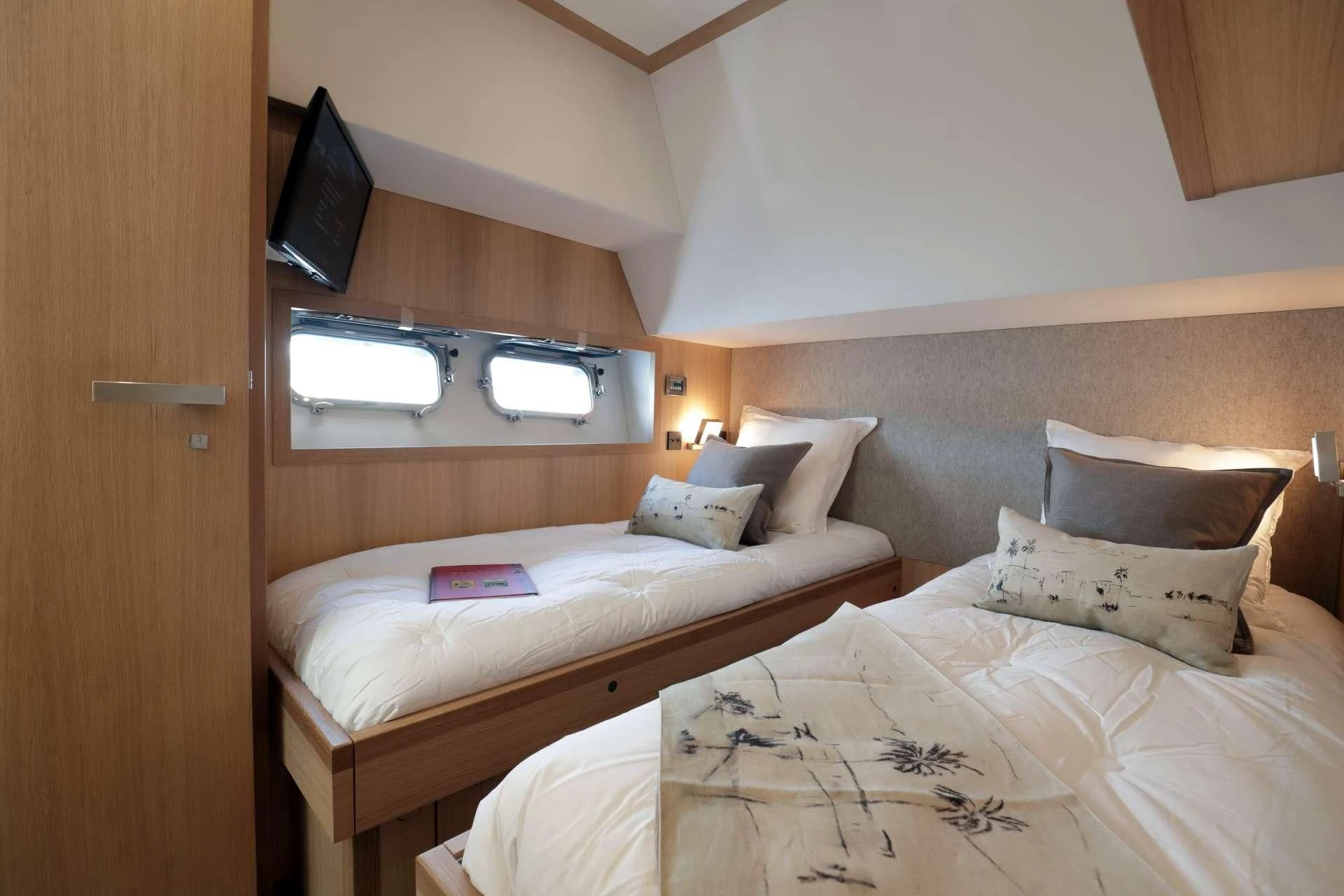 a room with two beds aboard ARMONEE Yacht for Sale