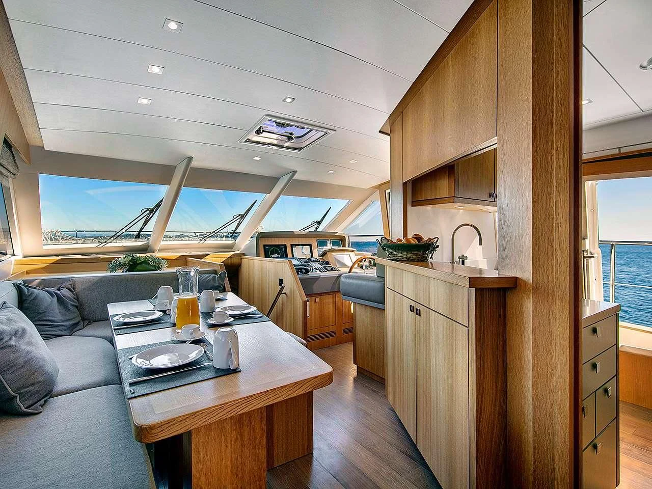 a room with a couch and a table aboard ARMONEE Yacht for Sale