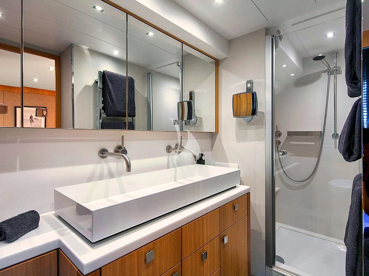 a bathroom with a large mirror aboard ARMONEE Yacht for Sale