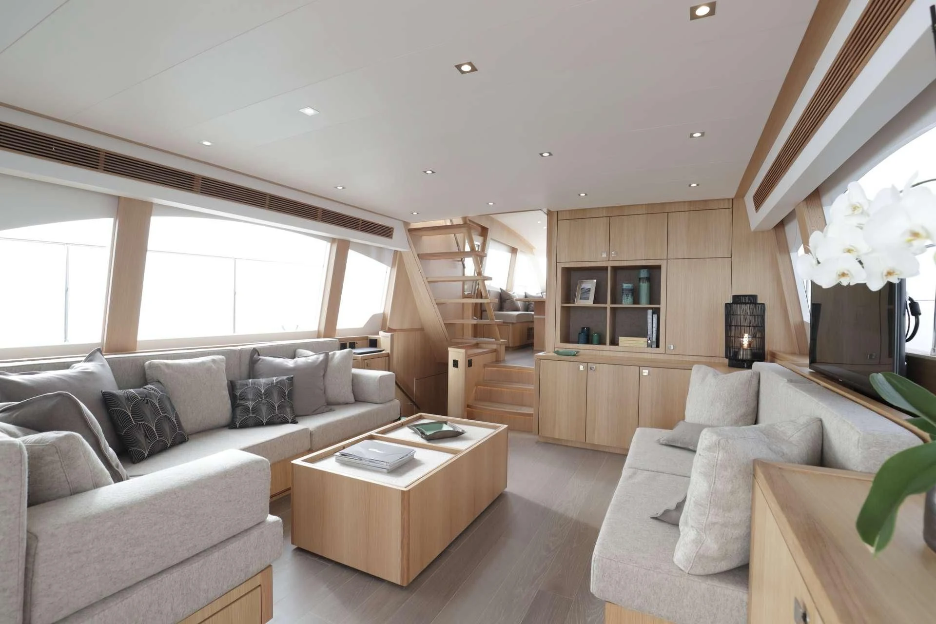 a living room with a couch and a coffee table aboard ARMONEE Yacht for Sale