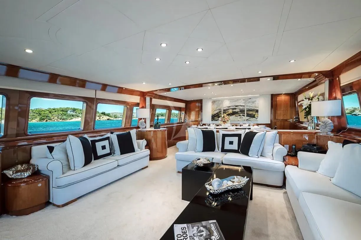 a large living room with a large window aboard THEION Yacht for Sale