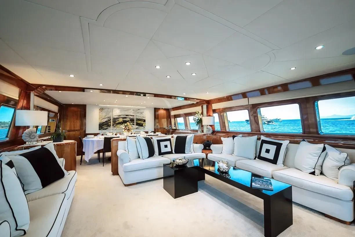 a living room with a large window aboard THEION Yacht for Sale