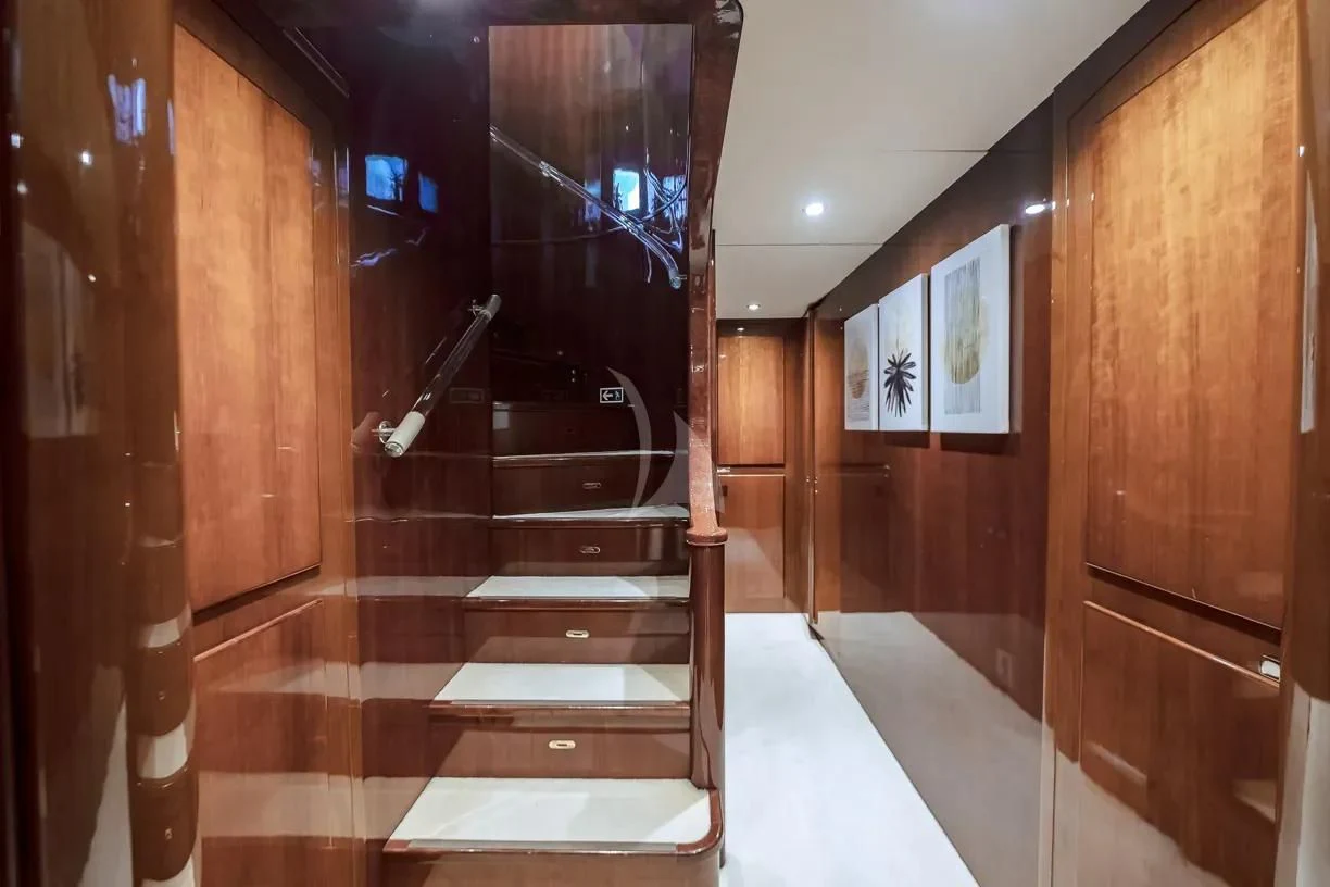 a hallway with wood cabinets aboard THEION Yacht for Sale