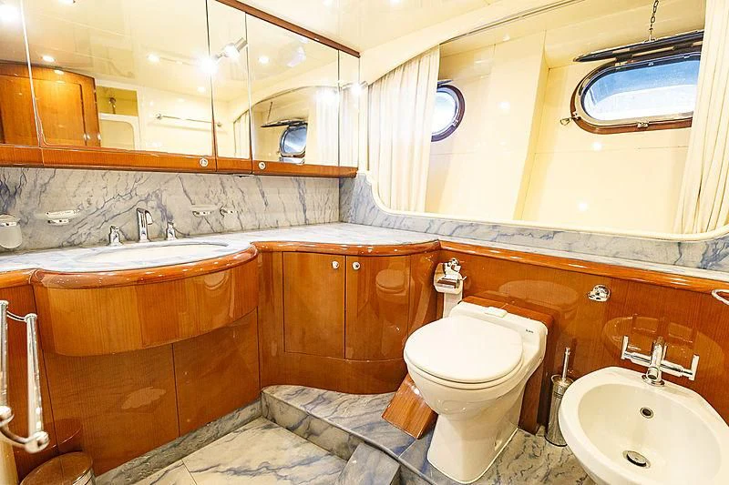 a bathroom with a toilet sink and a bathtub aboard THEION Yacht for Sale