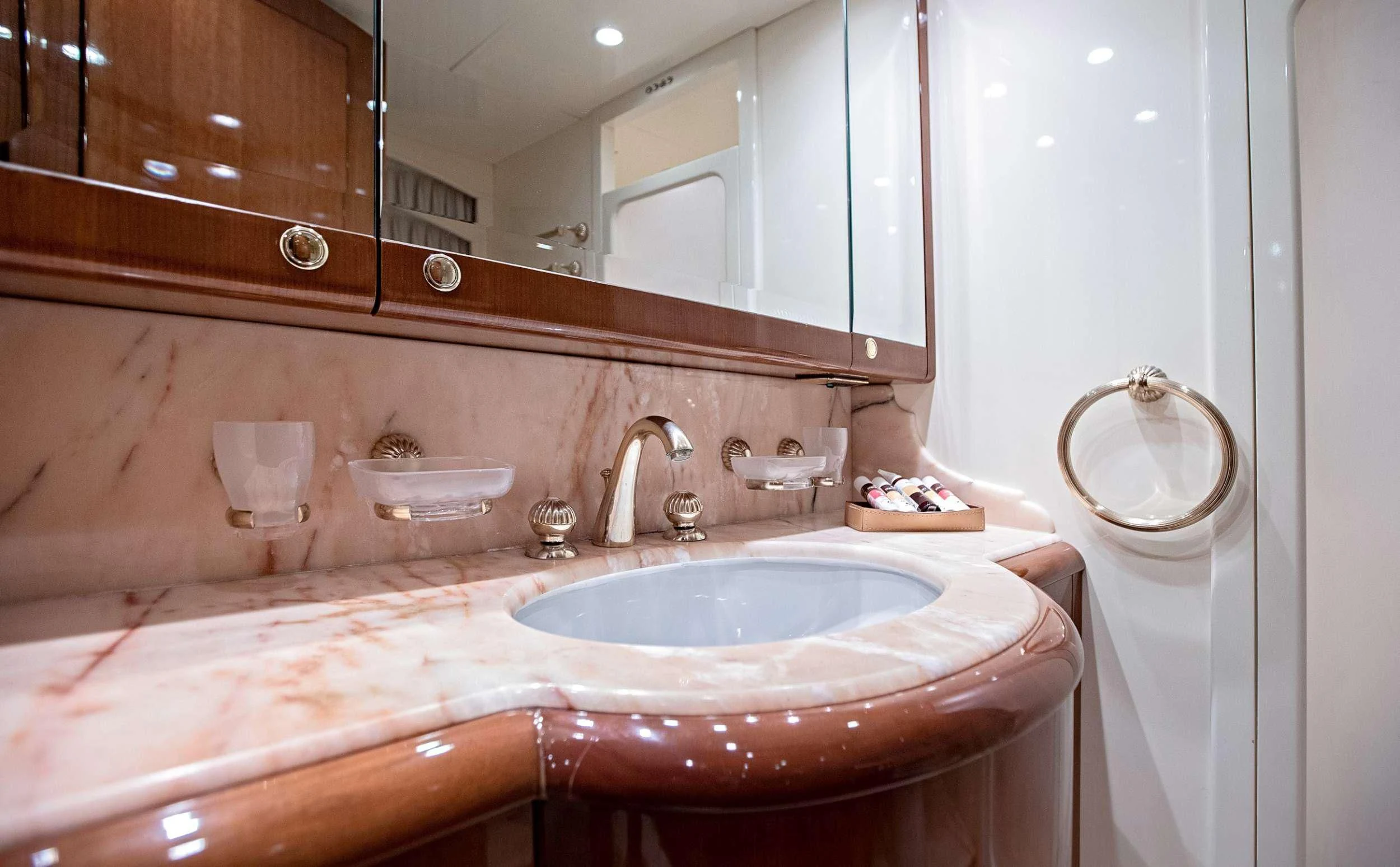 a bathroom with a sink and a mirror aboard THEION Yacht for Sale