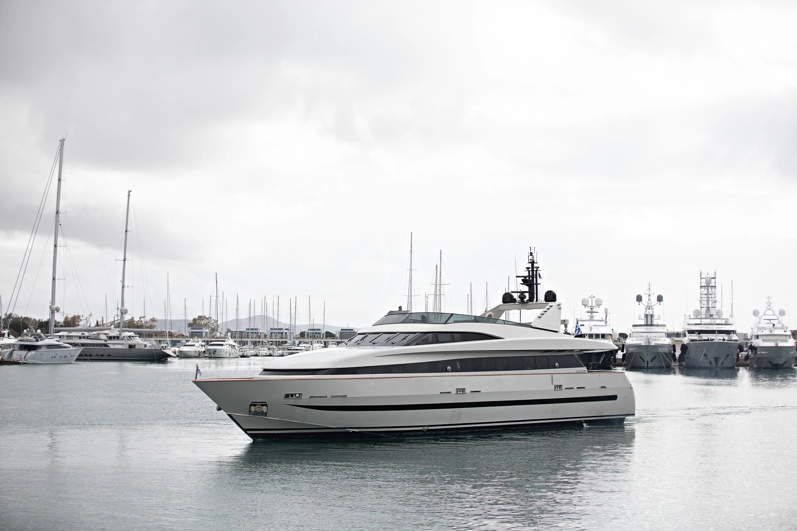 a group of boats in a harbor aboard THEION Yacht for Sale