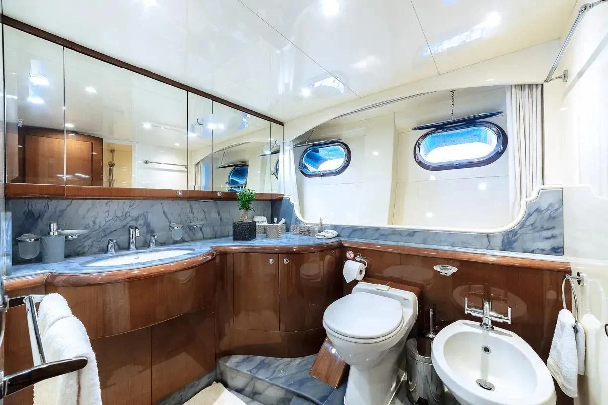 a bathroom with a large mirror aboard THEION Yacht for Sale