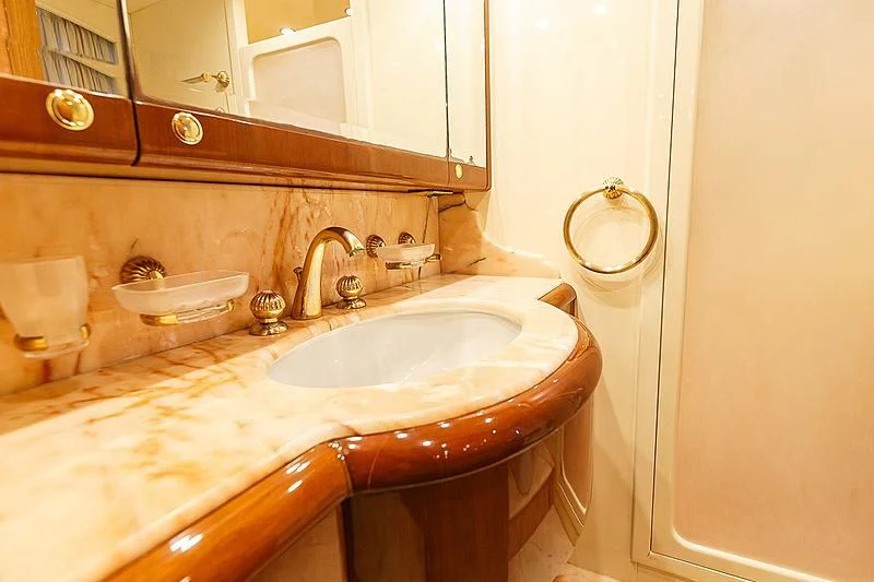 a bathroom with a sink and a mirror aboard THEION Yacht for Sale