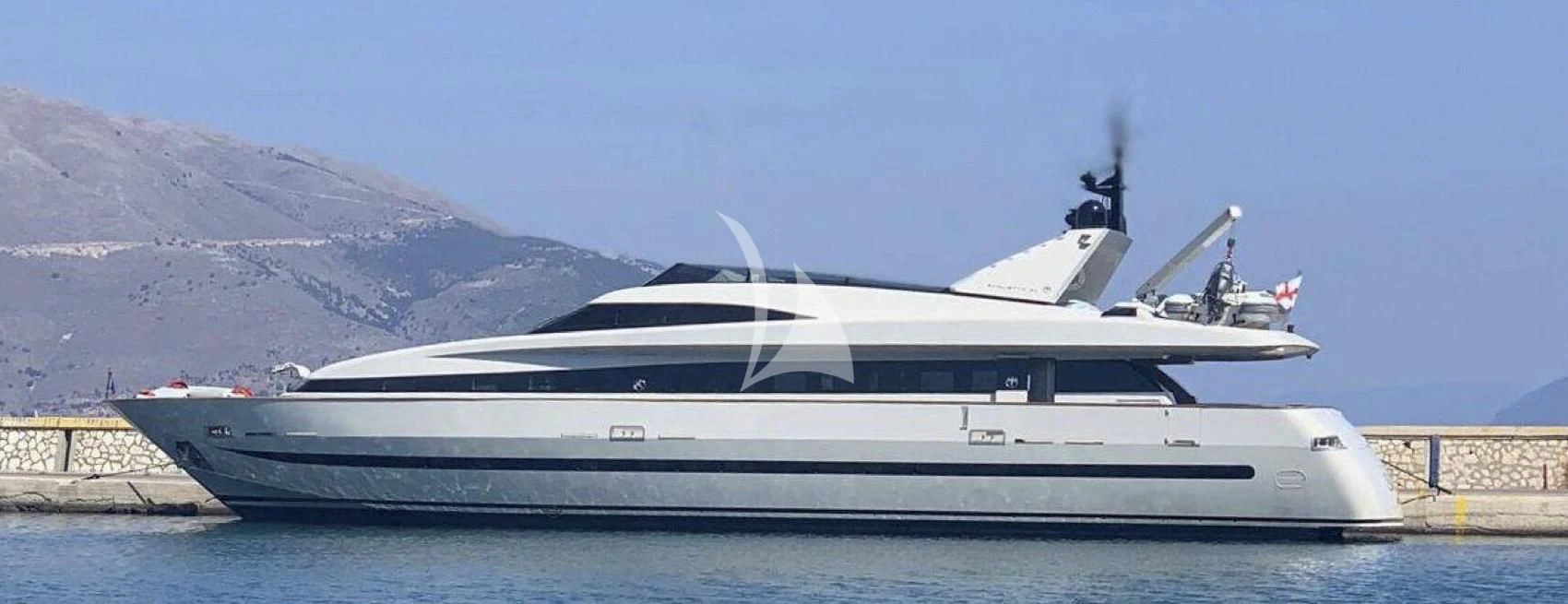 a white yacht on the water aboard THEION Yacht for Sale