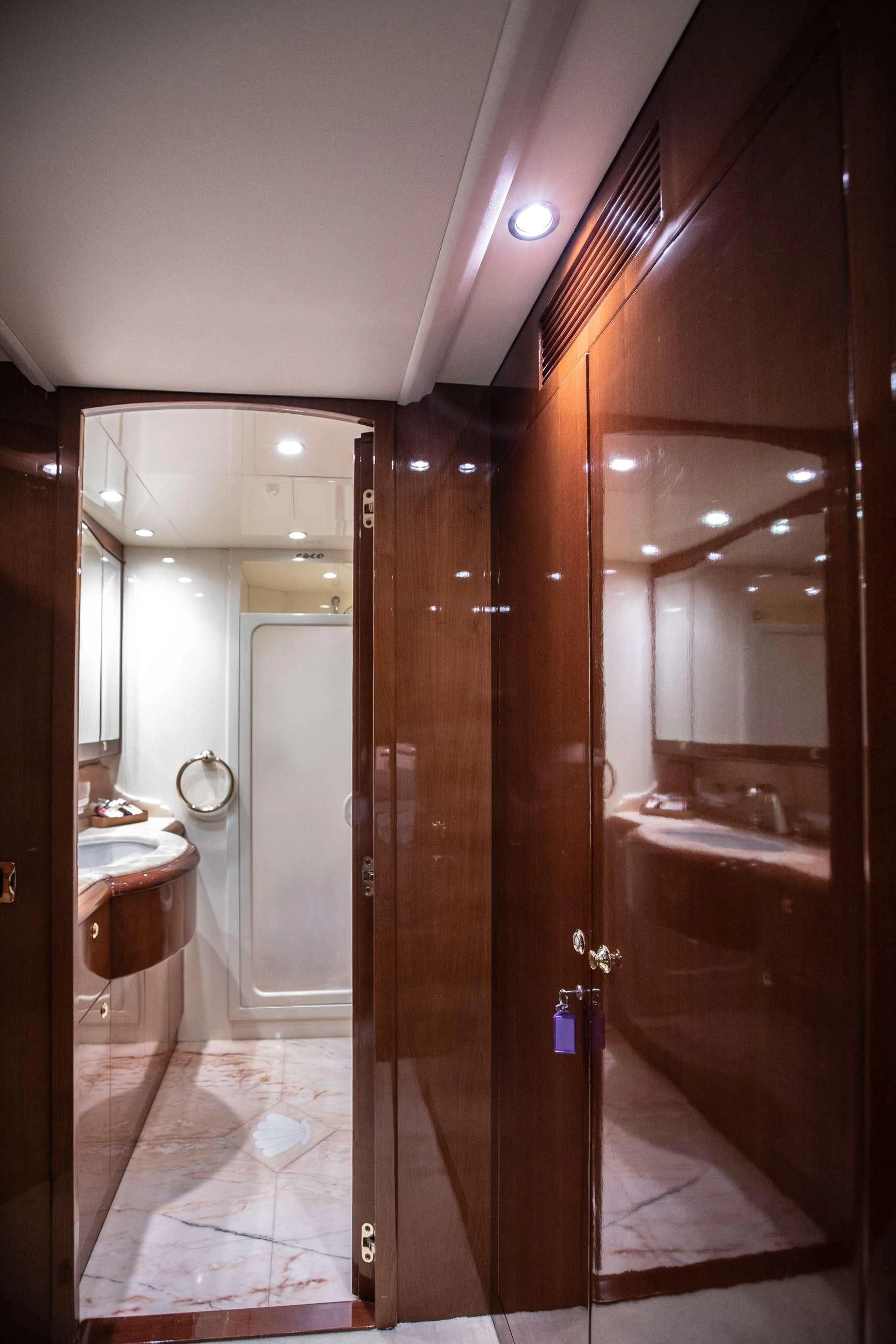 a bathroom with a large mirror aboard THEION Yacht for Sale