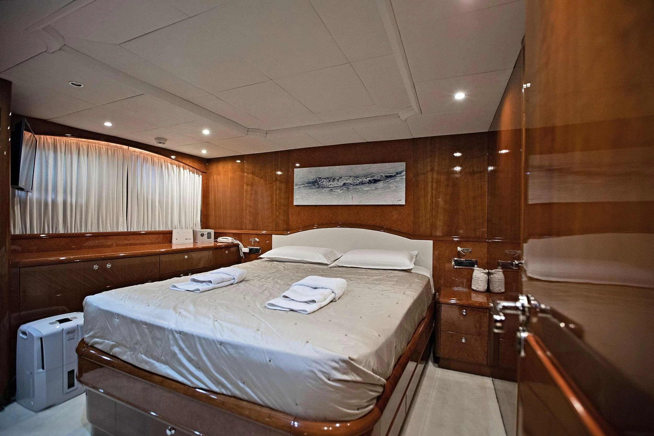 a bathroom with a bed and a sink aboard THEION Yacht for Sale