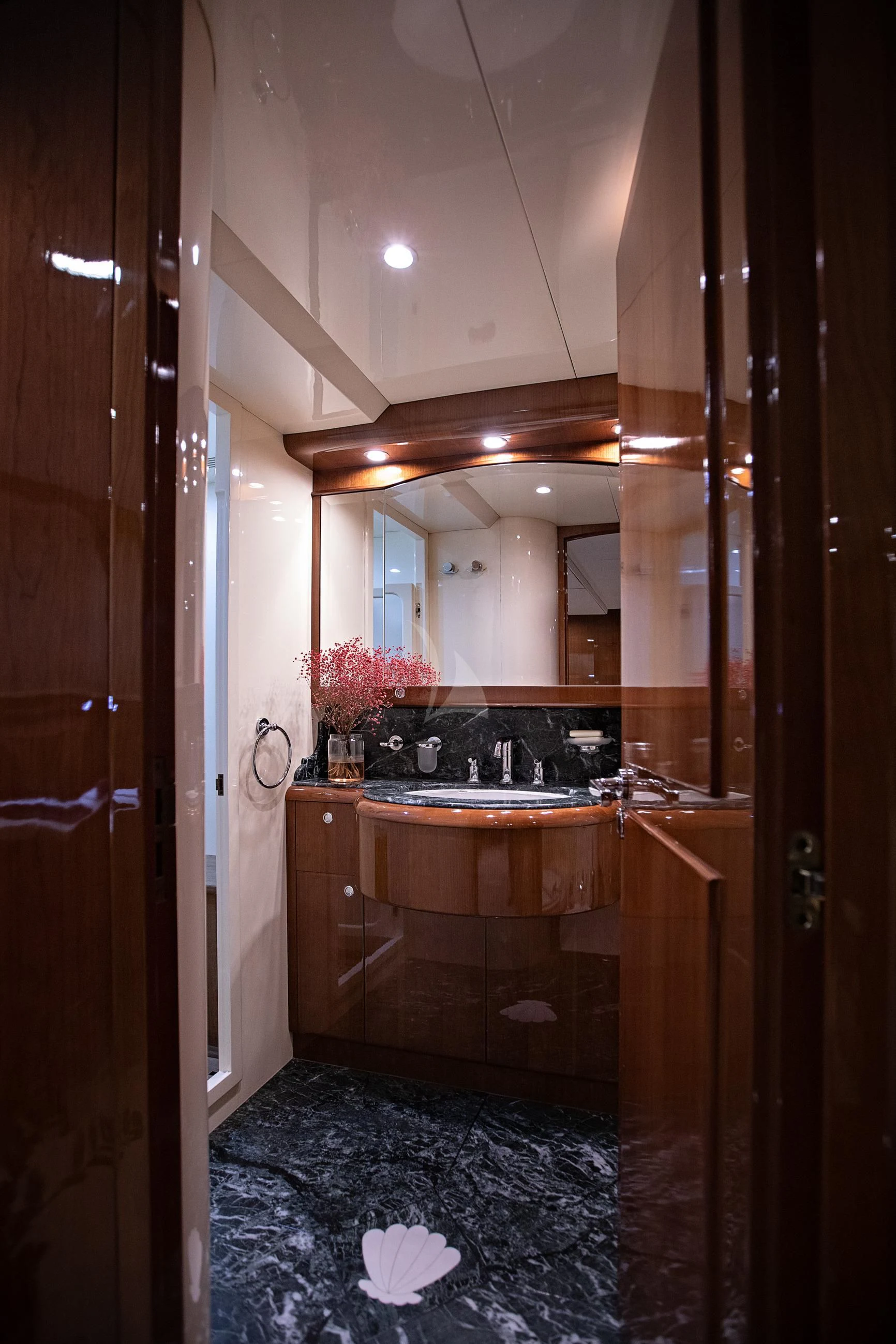 a bathroom with a sink and a mirror aboard THEION Yacht for Sale