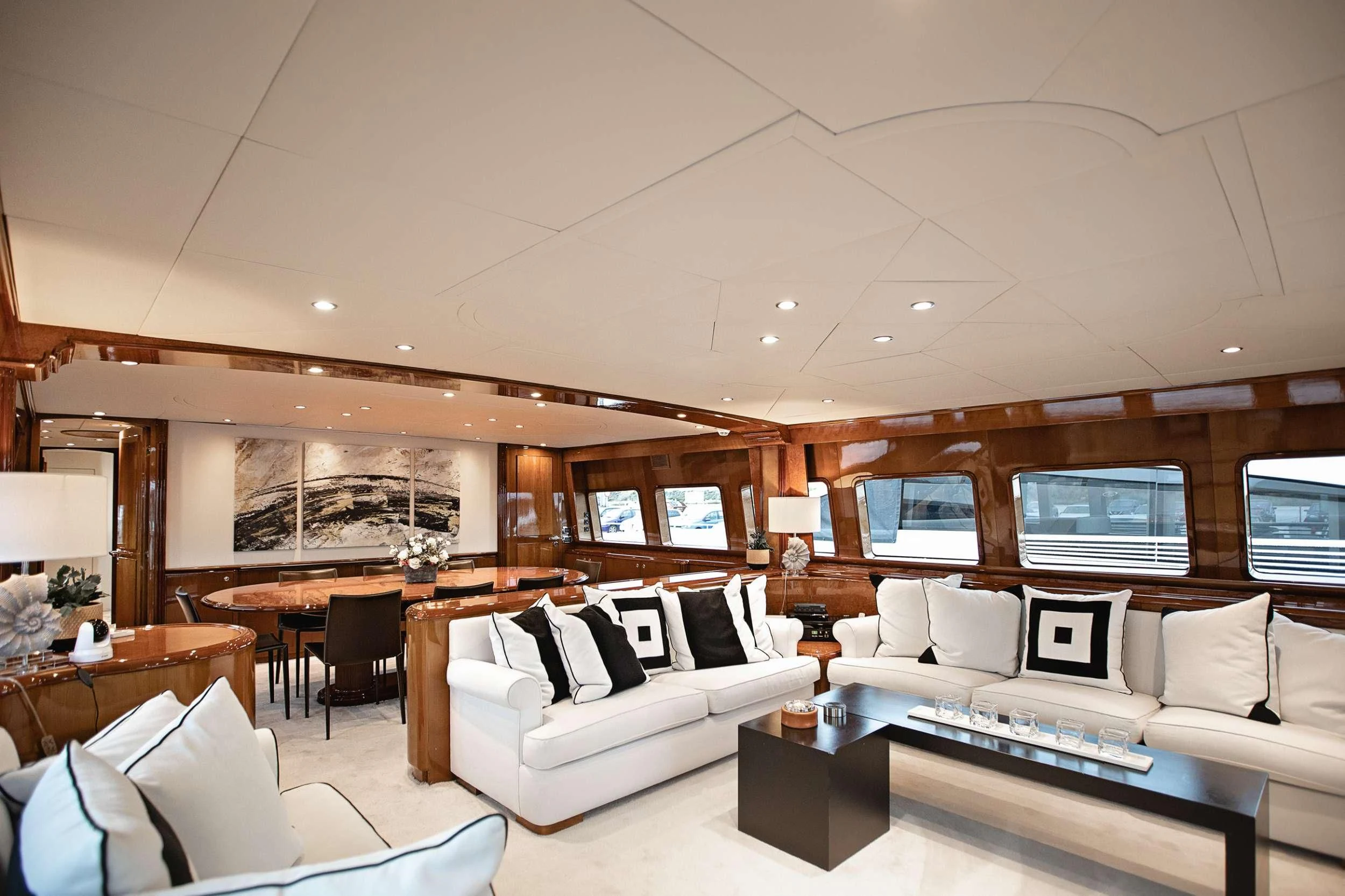 a living room with a large screen aboard THEION Yacht for Sale