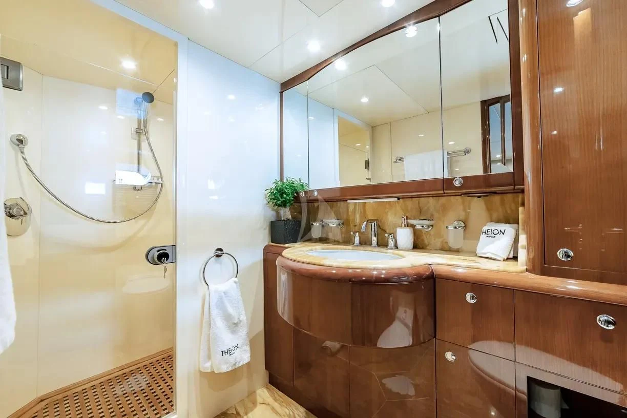 a bathroom with a large mirror aboard THEION Yacht for Sale