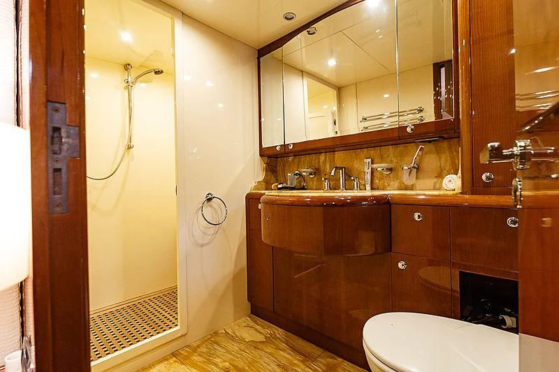 a bathroom with a shower and a toilet aboard THEION Yacht for Sale