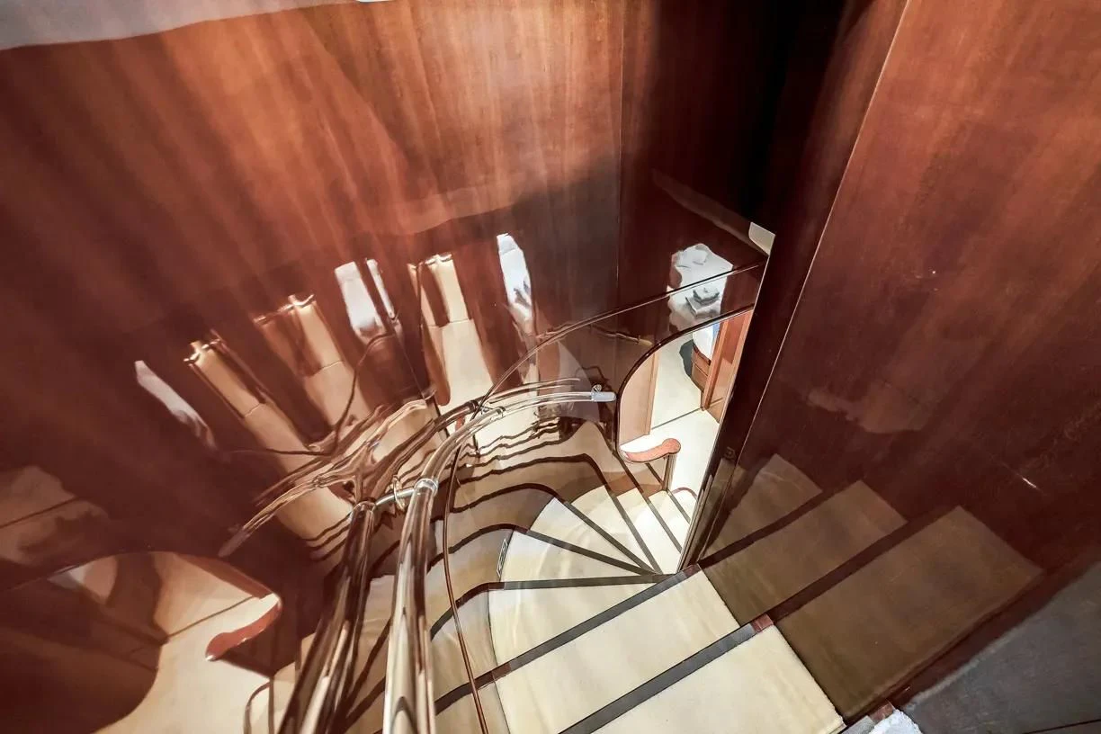 a staircase with a railing aboard THEION Yacht for Sale