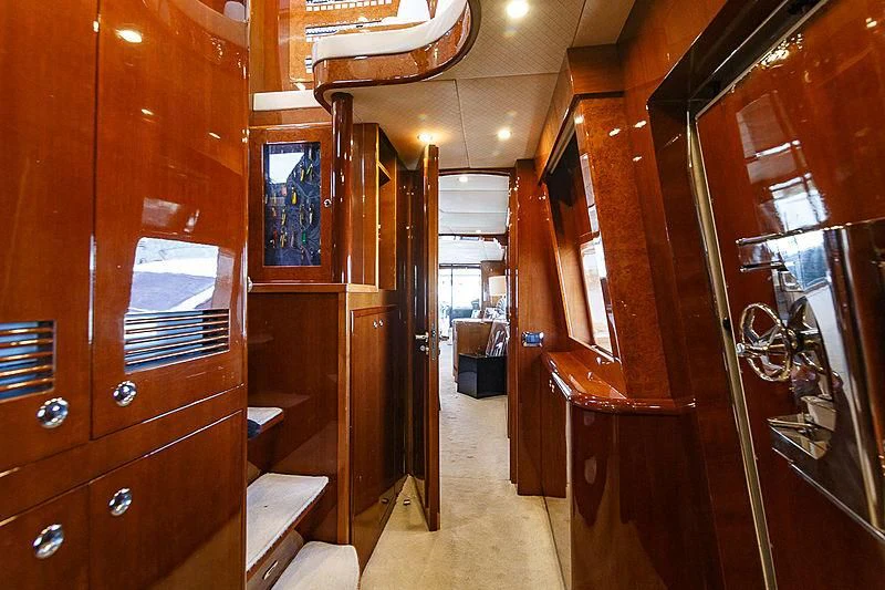 a room with wooden cabinets aboard THEION Yacht for Sale