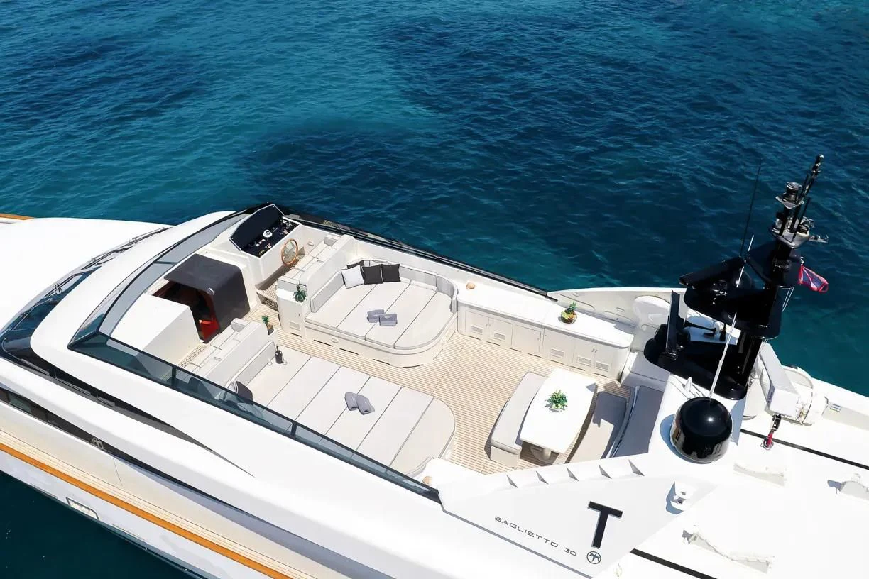 a white boat with black wheels aboard THEION Yacht for Sale