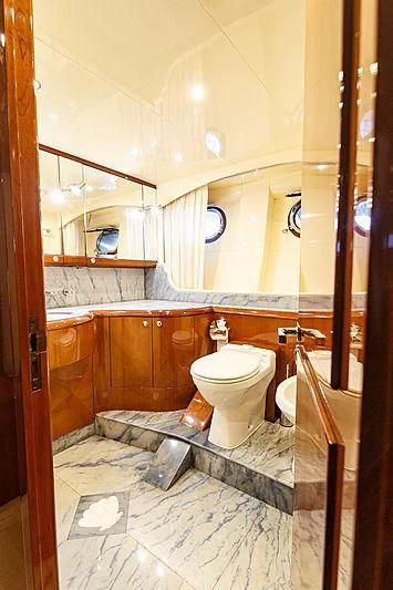 a bathroom with a toilet and a sink aboard THEION Yacht for Sale