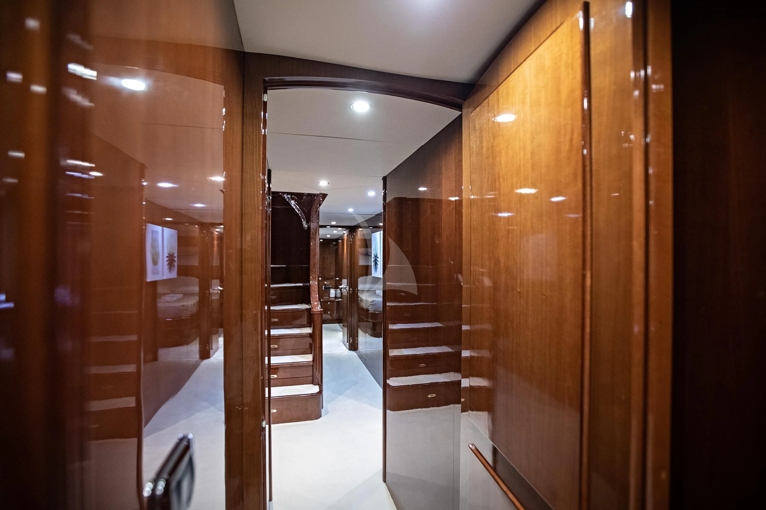 a hallway with wooden cabinets aboard THEION Yacht for Sale