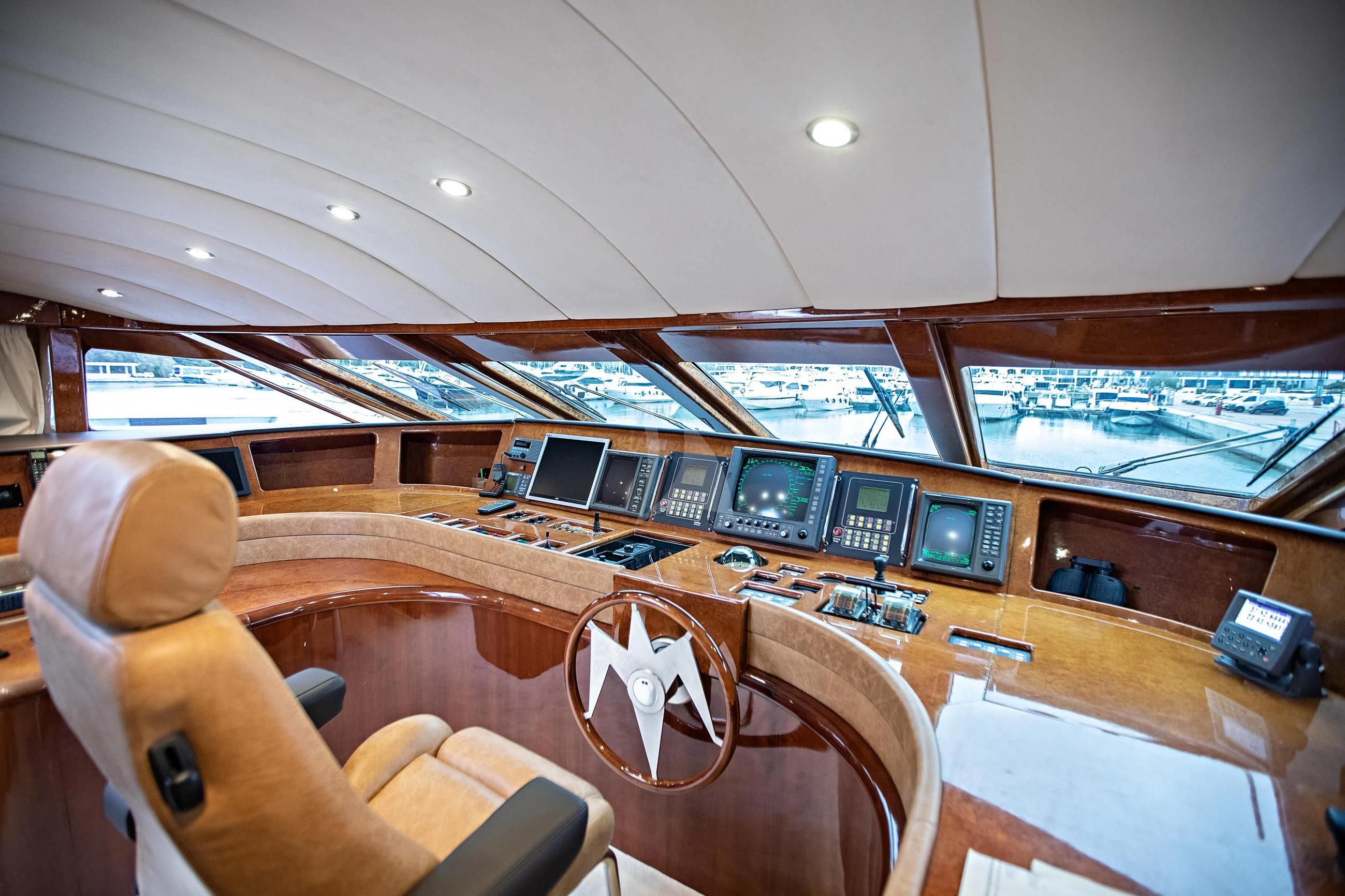 a room with a desk and chairs aboard THEION Yacht for Sale