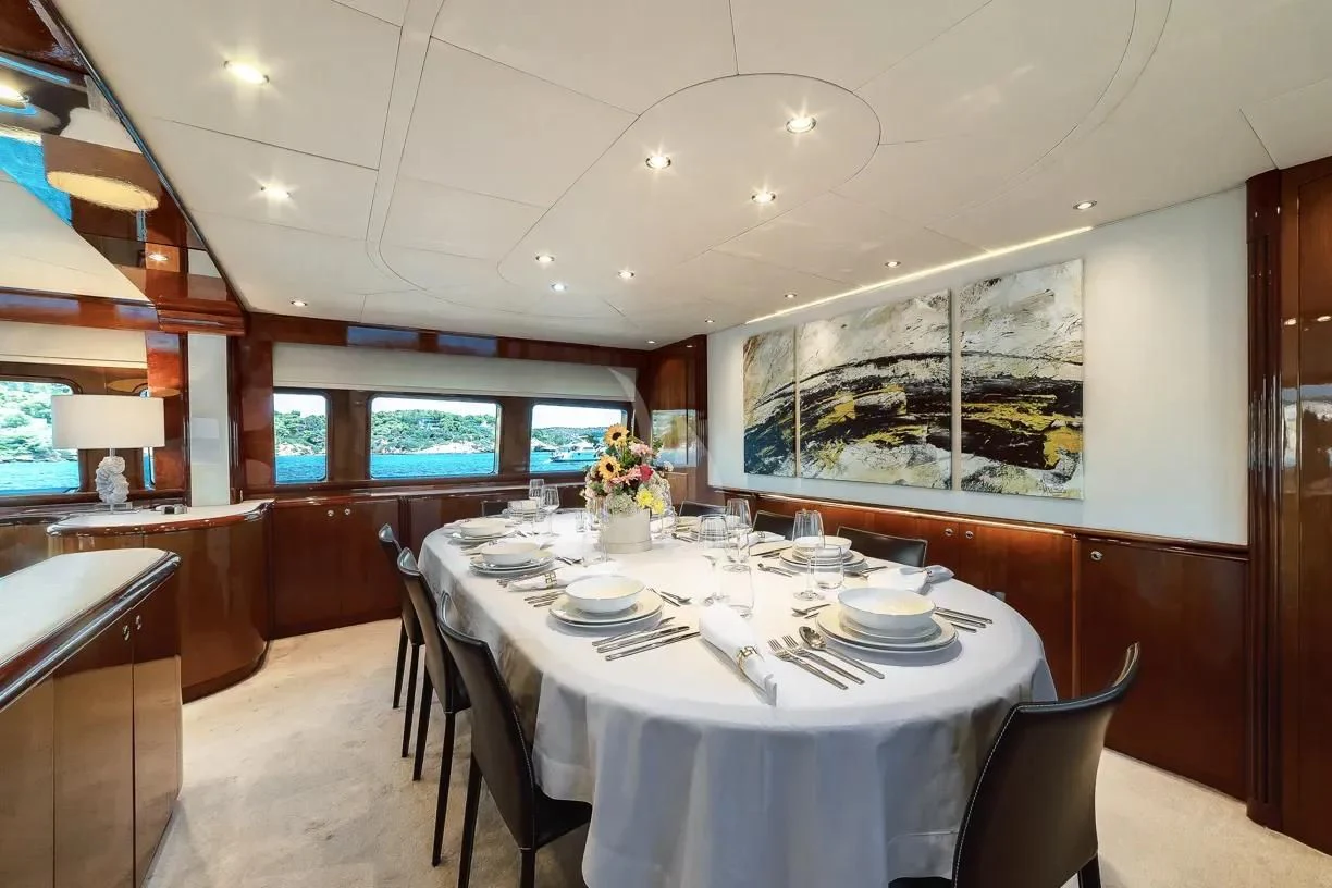 a dining room with a table set aboard THEION Yacht for Sale