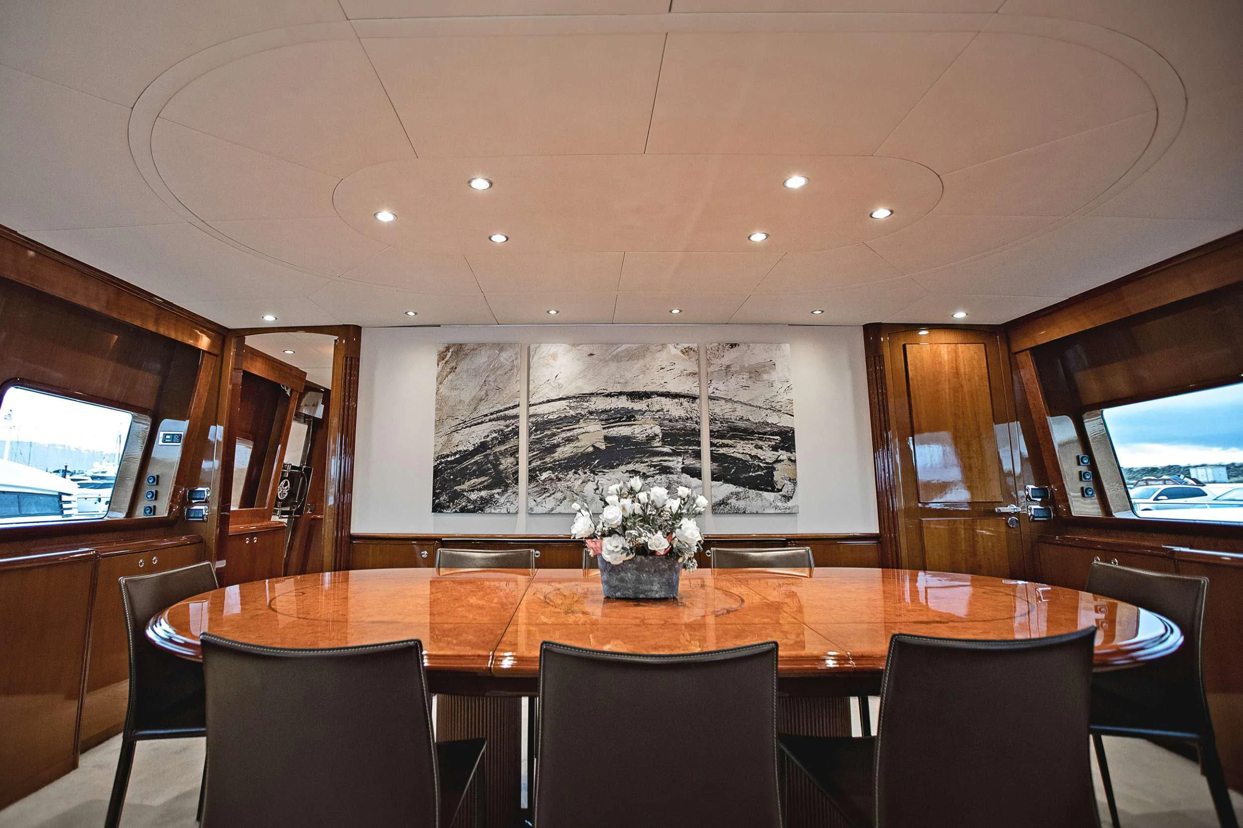 a large room with a table and chairs aboard THEION Yacht for Sale