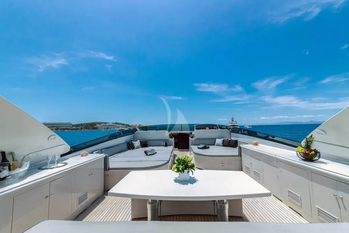 a room with a table and chairs aboard THEION Yacht for Sale