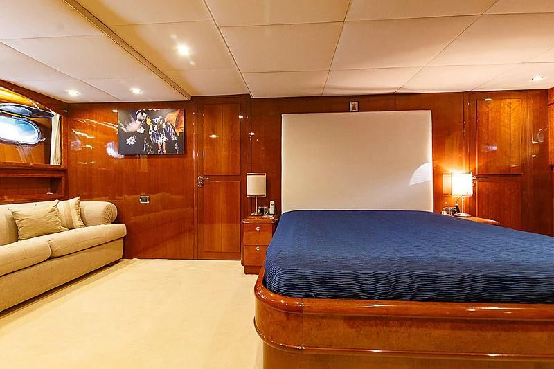 a bed and a couch in a room aboard THEION Yacht for Sale