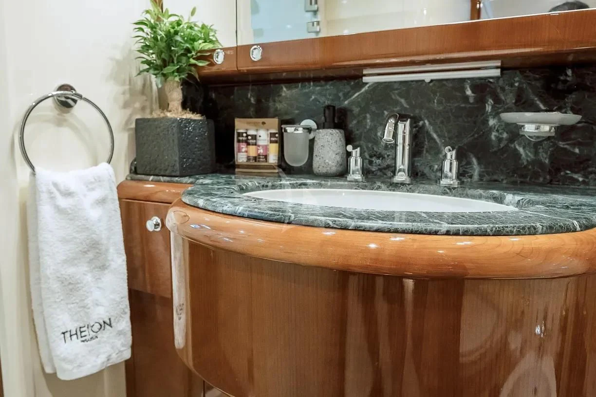 a sink with a towel on the wall aboard THEION Yacht for Sale