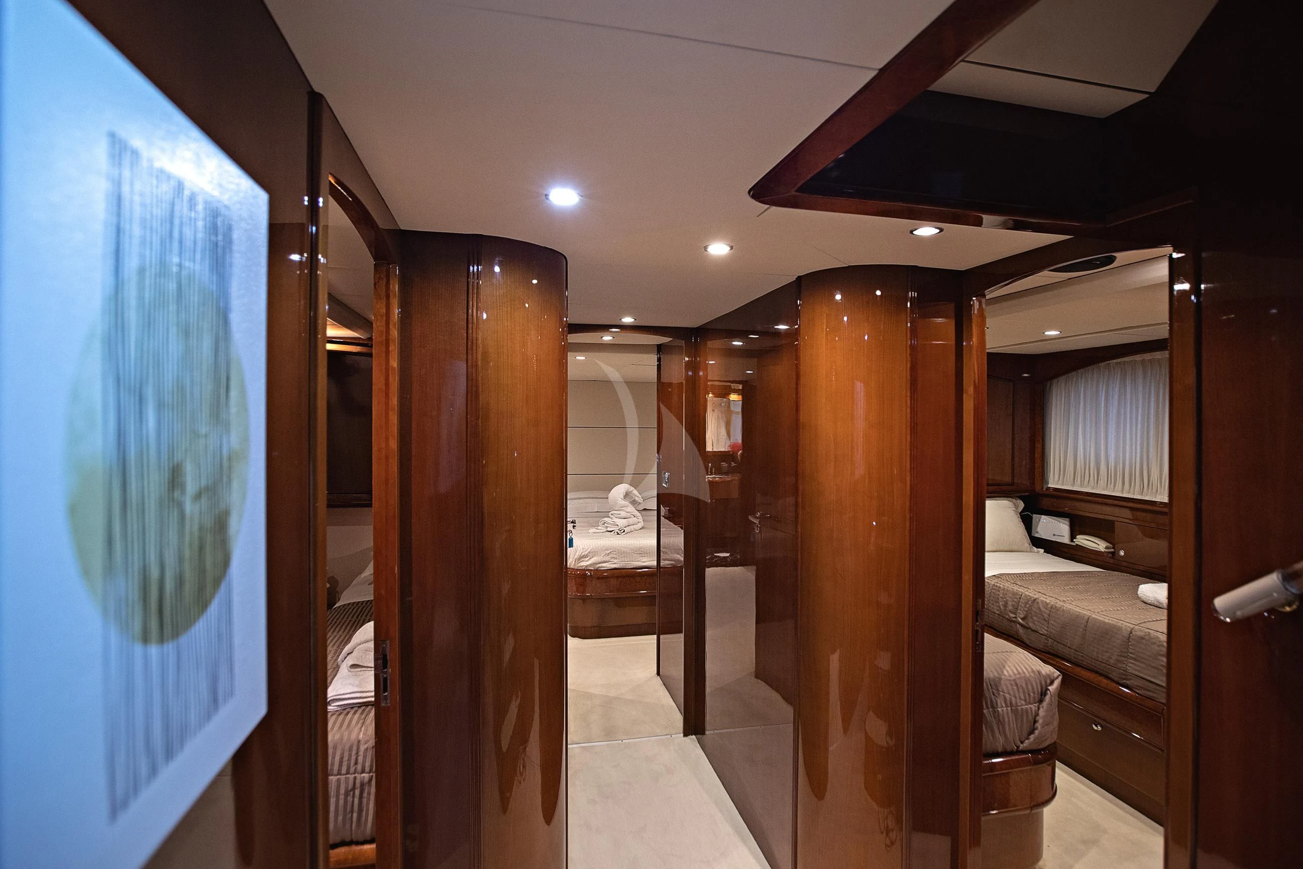 a room with a bed and a window aboard THEION Yacht for Sale