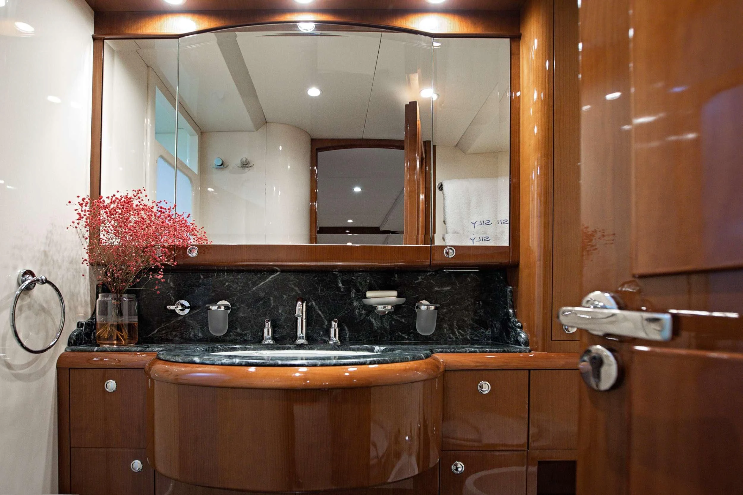 a bathroom with a large mirror aboard THEION Yacht for Sale