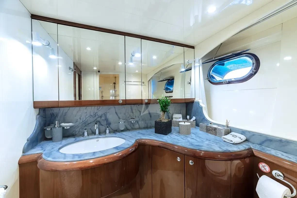 a bathroom with a large mirror aboard THEION Yacht for Sale
