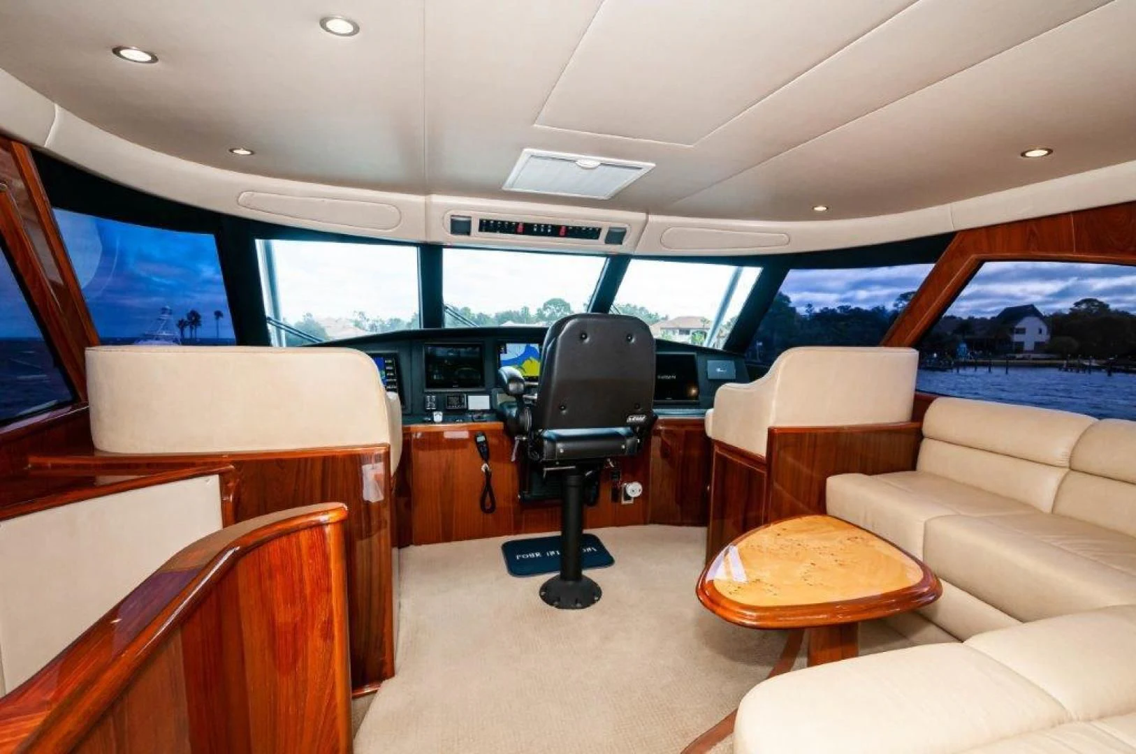 a room with a chair and a table and a tv aboard POUR INTENTIONS Yacht for Sale