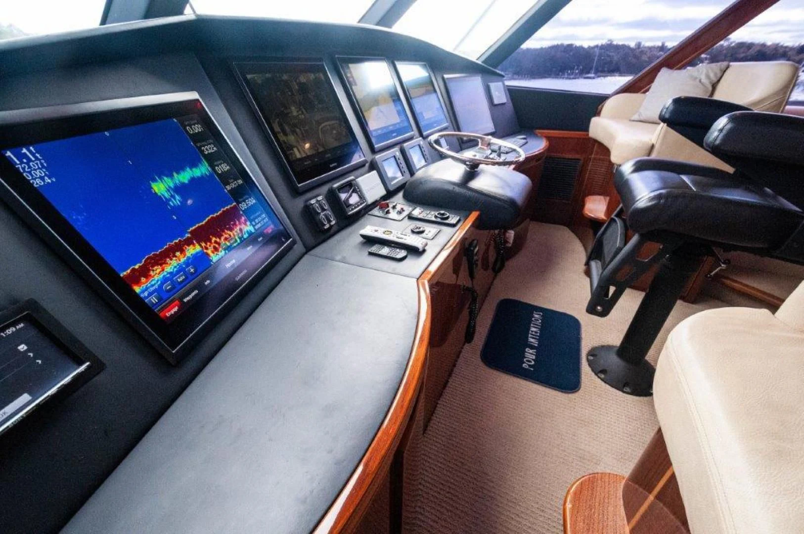a computer on a table aboard POUR INTENTIONS Yacht for Sale