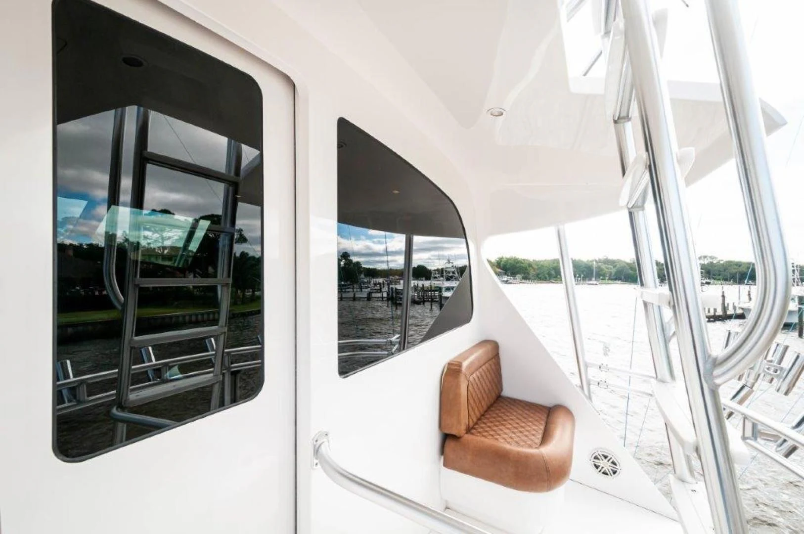 a boat with a chair and a bench on the deck aboard POUR INTENTIONS Yacht for Sale