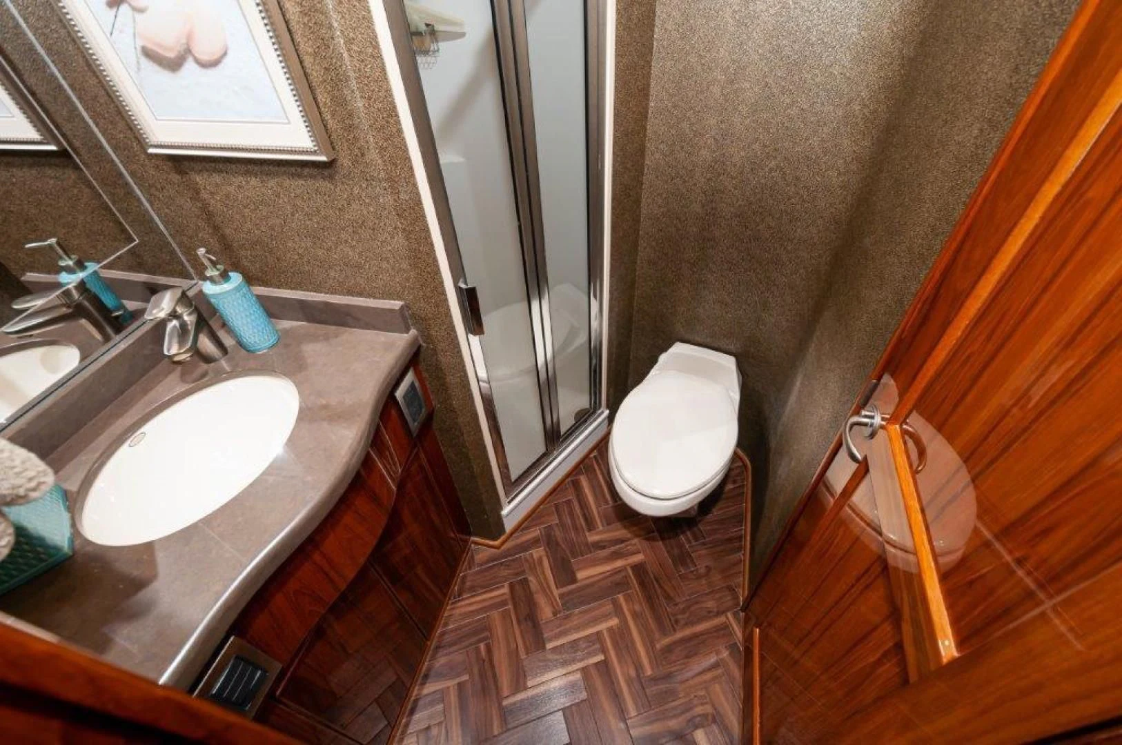 a bathroom with a sink and a toilet aboard POUR INTENTIONS Yacht for Sale