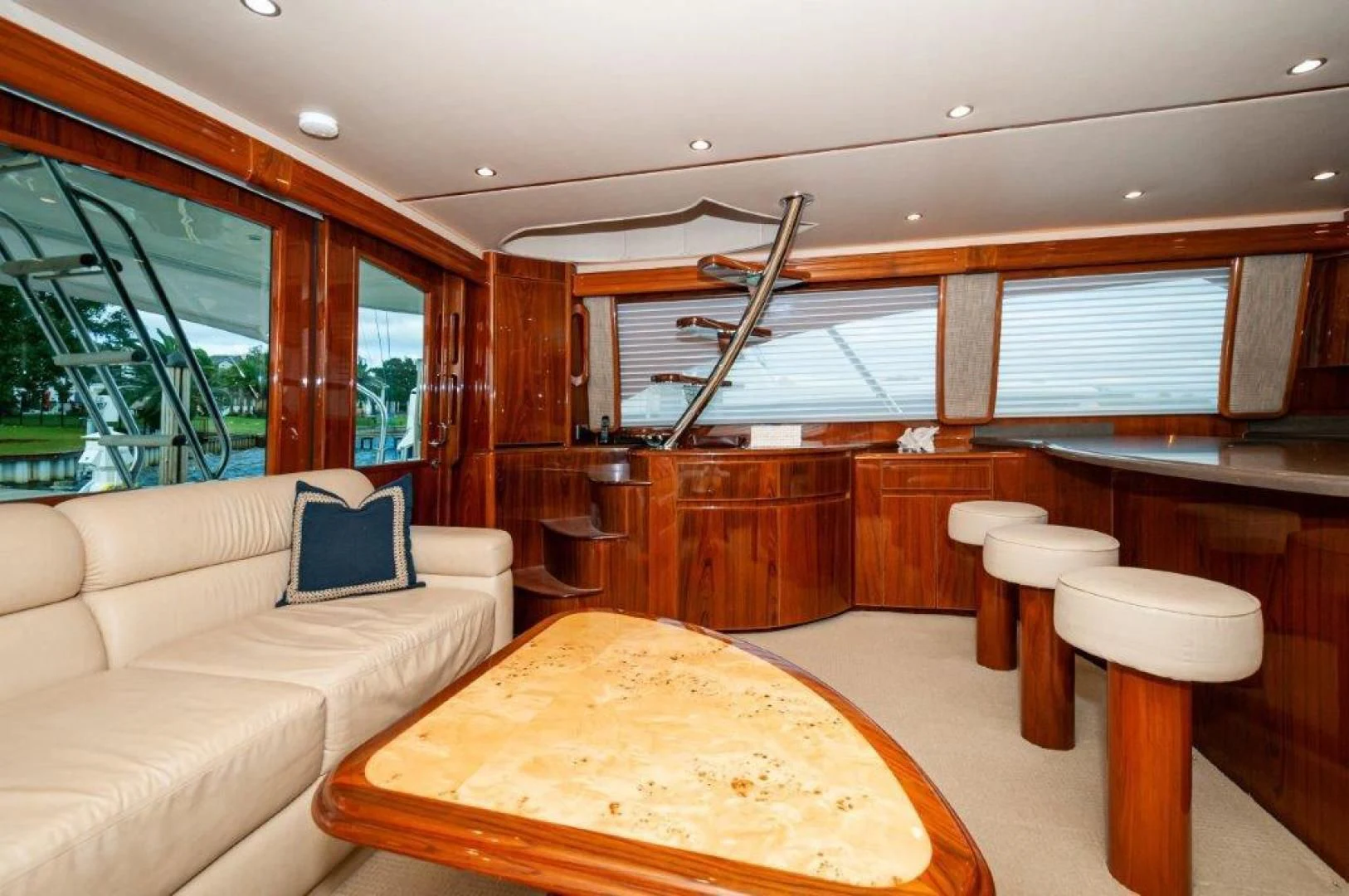 a room with a table and couch aboard POUR INTENTIONS Yacht for Sale