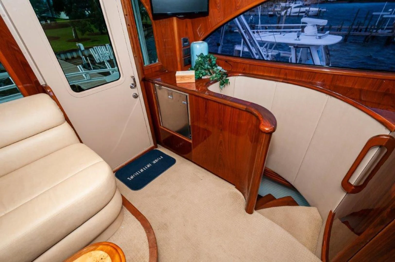a living room with a large pool table and chairs aboard POUR INTENTIONS Yacht for Sale