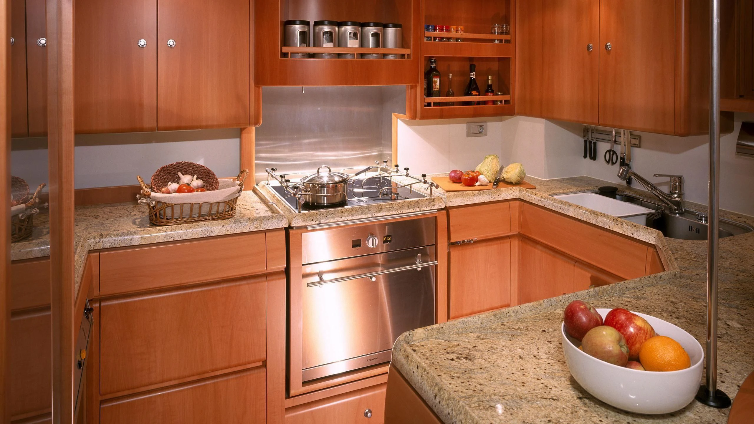 a kitchen with a bowl of fruit aboard STALLA DE MUR Yacht for Sale