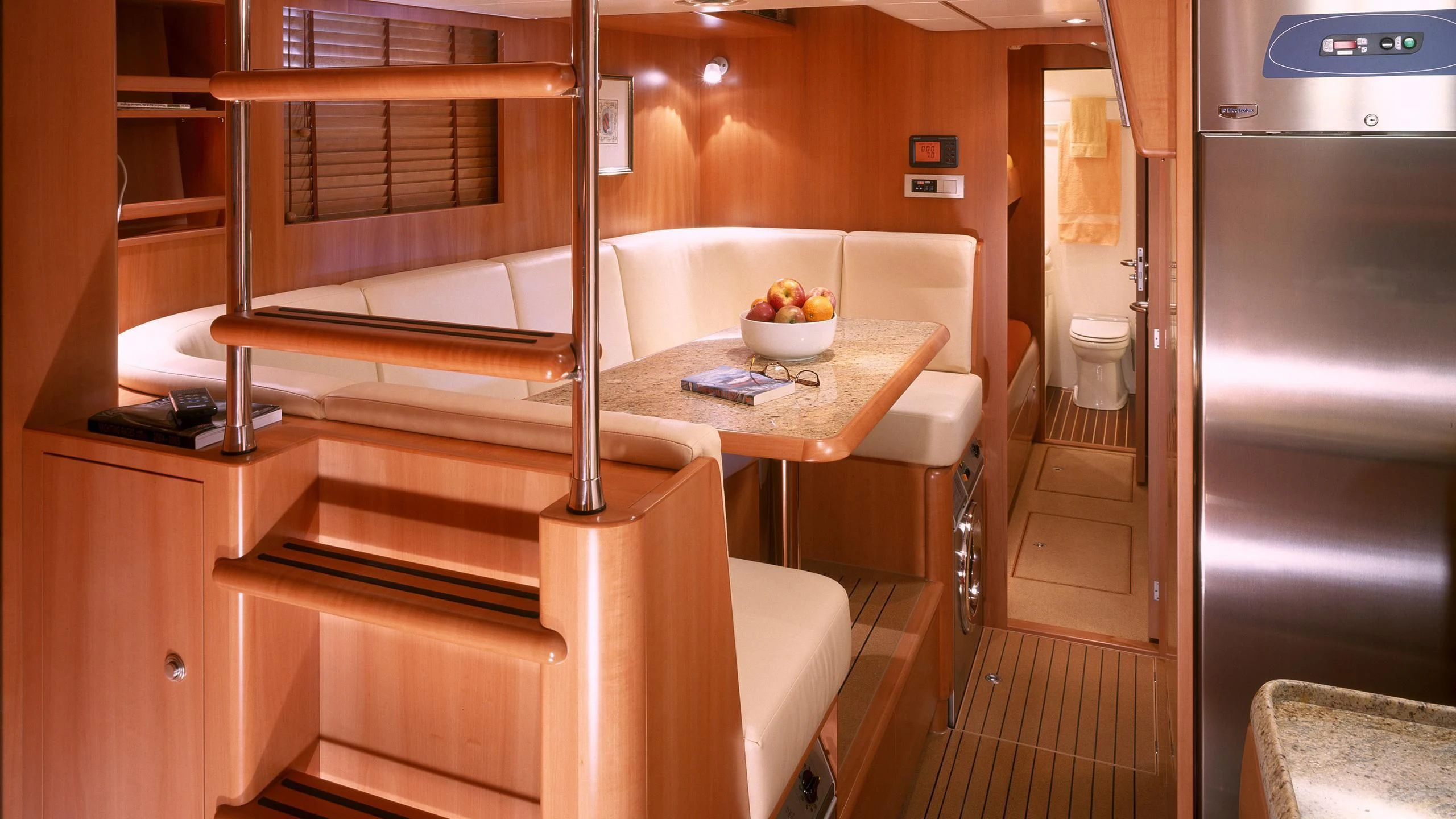 a kitchen with a table and chairs aboard STALLA DE MUR Yacht for Sale