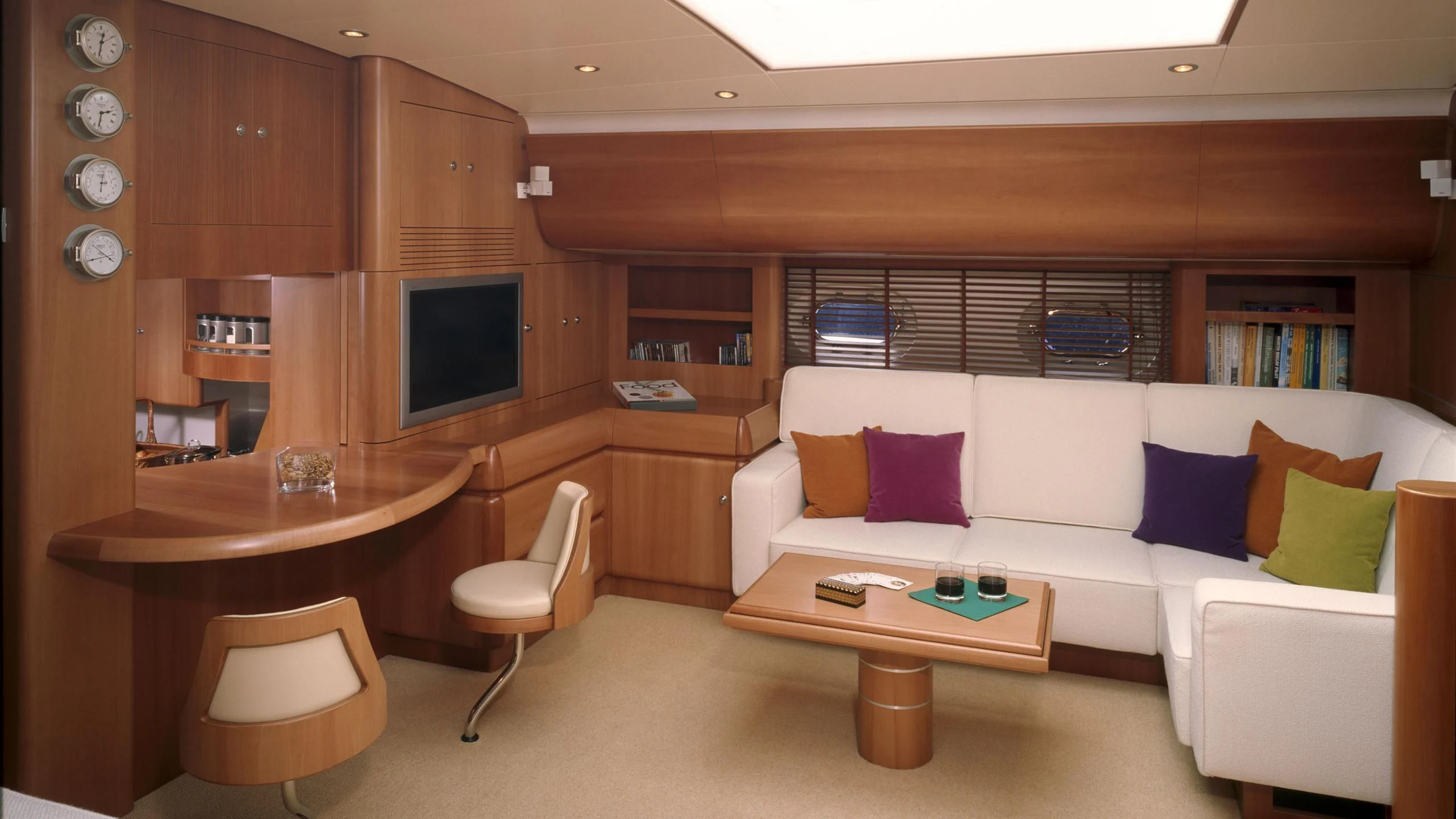 a living room with a couch and a table aboard STALLA DE MUR Yacht for Sale
