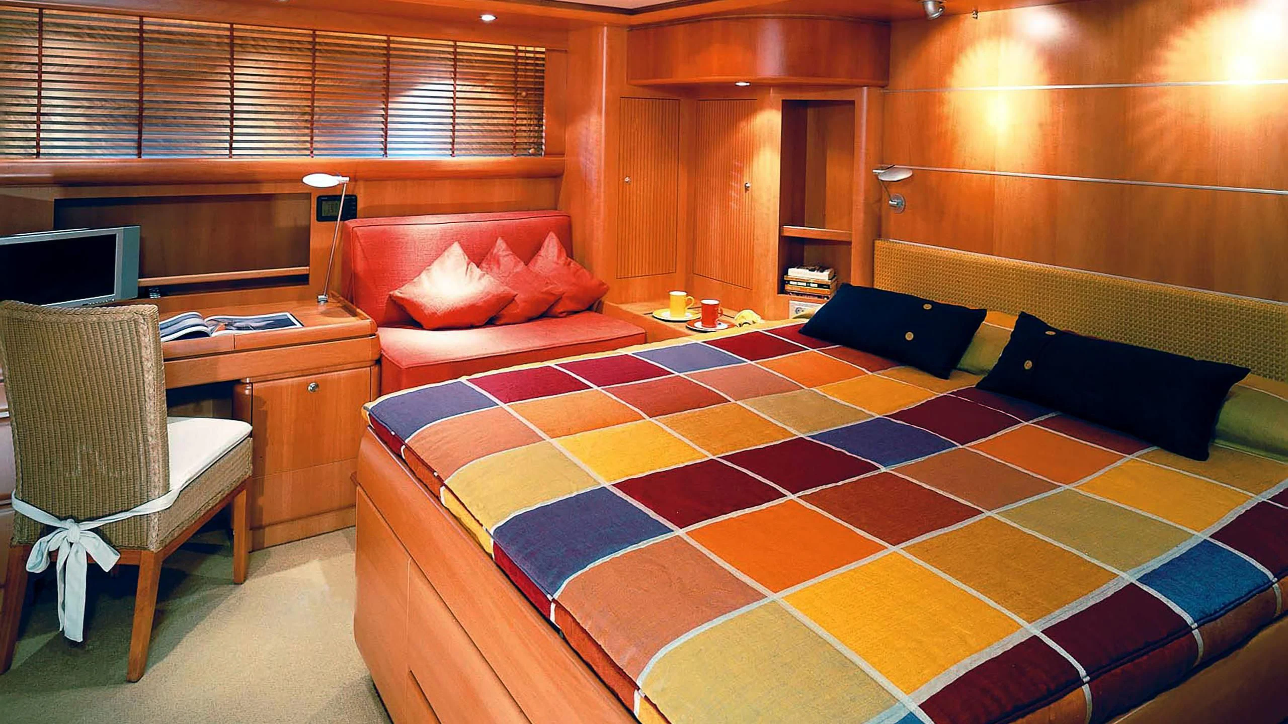 a bedroom with a bed and desk aboard STALLA DE MUR Yacht for Sale