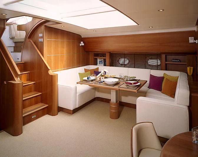 a room with a couch and a table aboard STALLA DE MUR Yacht for Sale