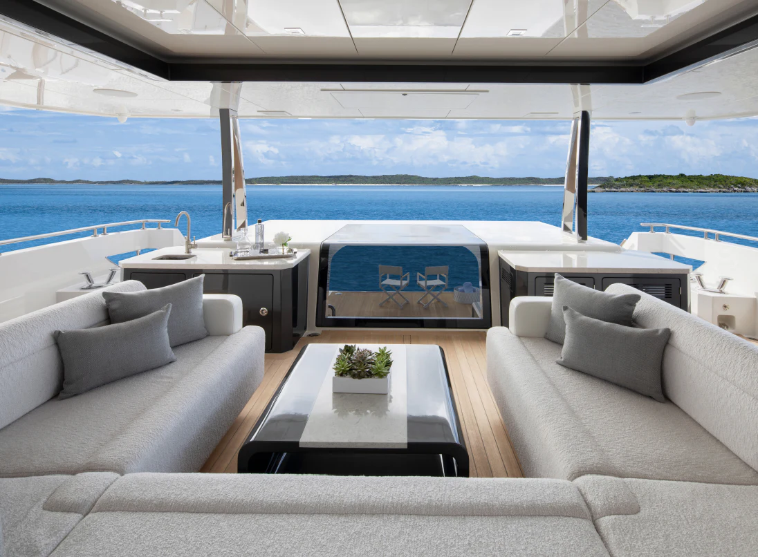 a living room with a large blue ocean aboard MAVERICK Yacht for Sale