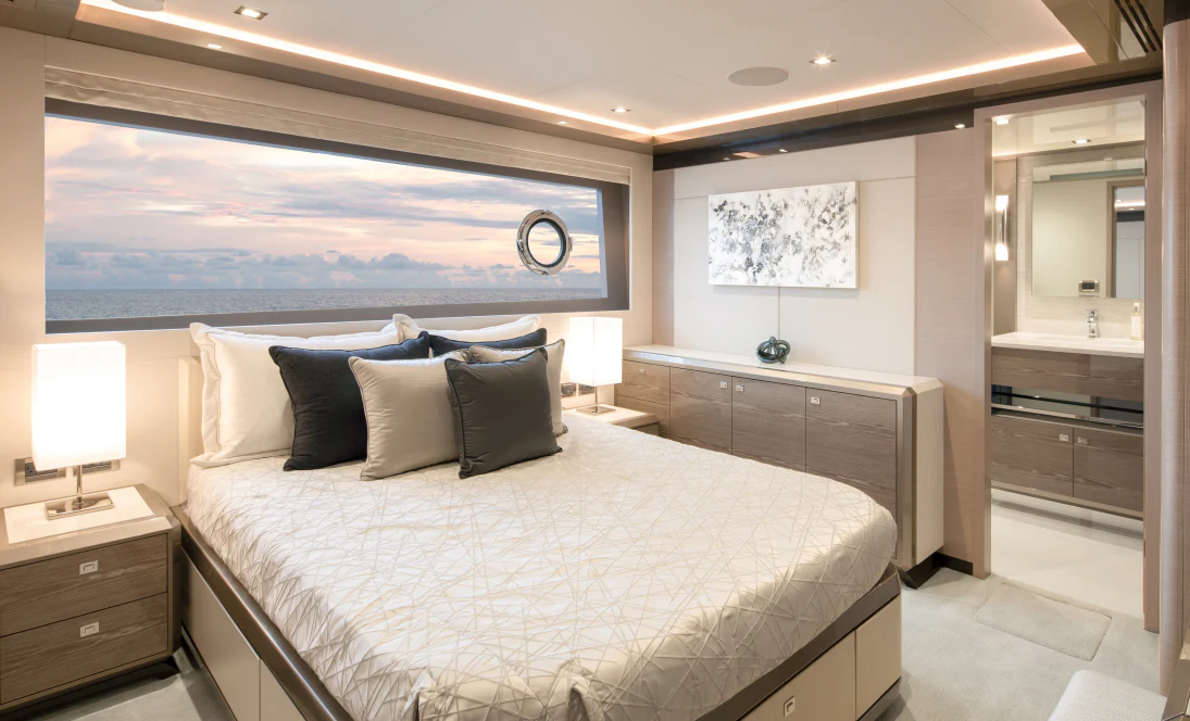 a large bedroom with a large bed aboard MAVERICK Yacht for Sale