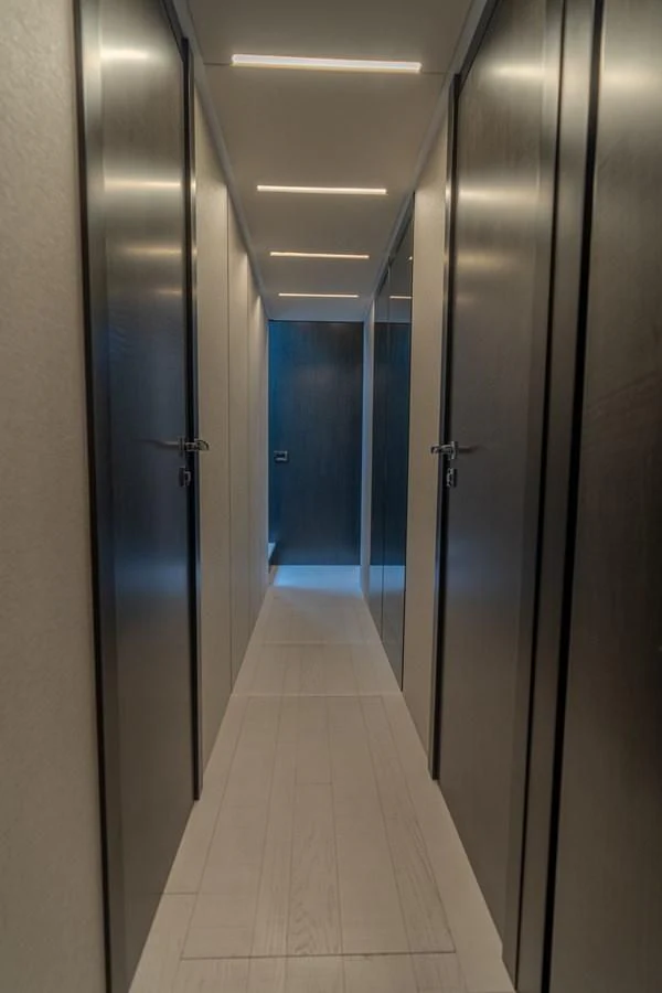 a hallway with doors aboard VINTAGE Yacht for Sale